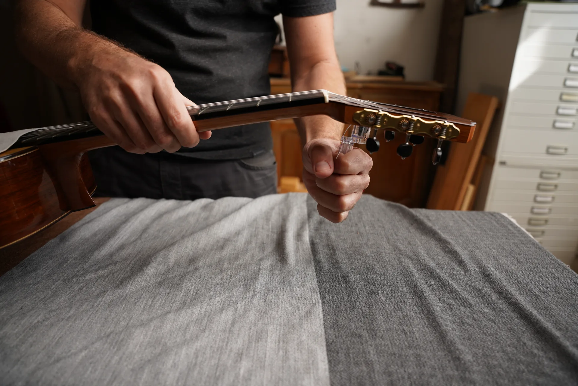 Tighten the string while keeping the loop locked against the post