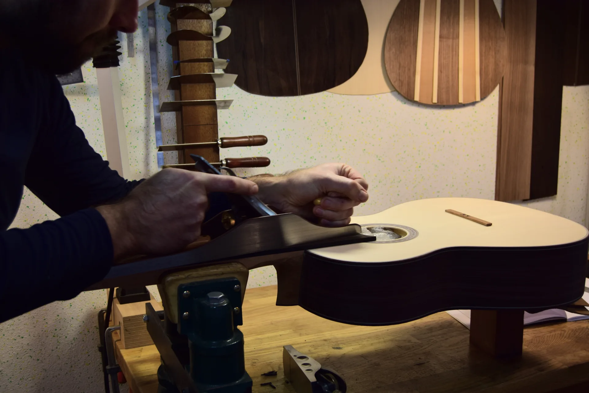 Flattening the fingerboard with a jointer plane — a long-soled hand plane with perfectly sharpened blades