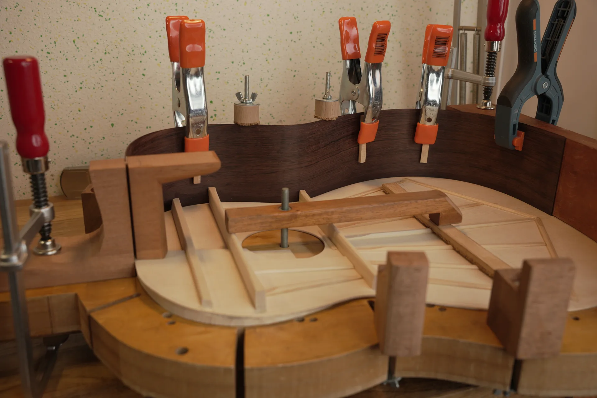 Gluing and clamping the first side in place