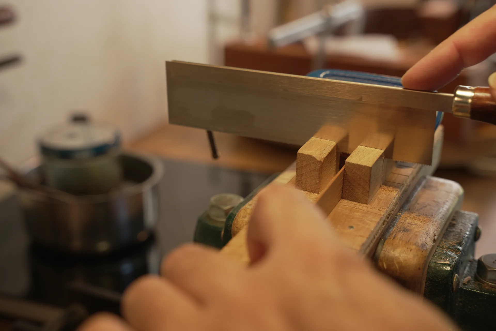 Cutting lining blocks one by one in a mitre box