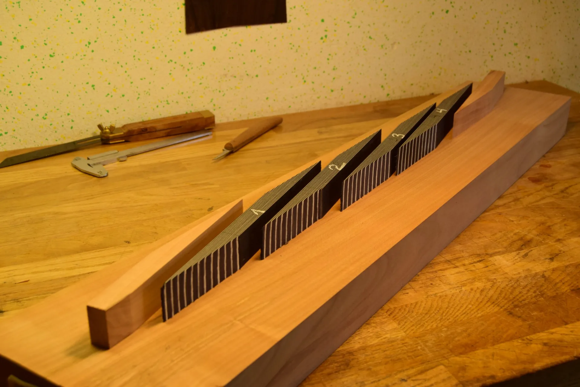 The cut pieces laid out in order and numbered to preserve their sequence