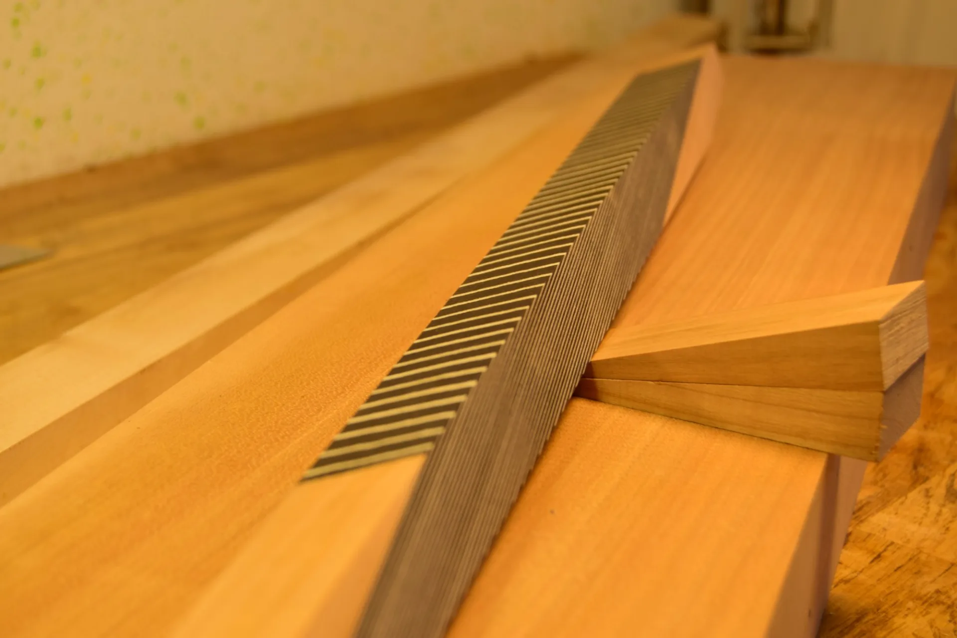 Planing the reassembled stick to ensure its faces are perfectly square — the marquetry lines must remain parallel